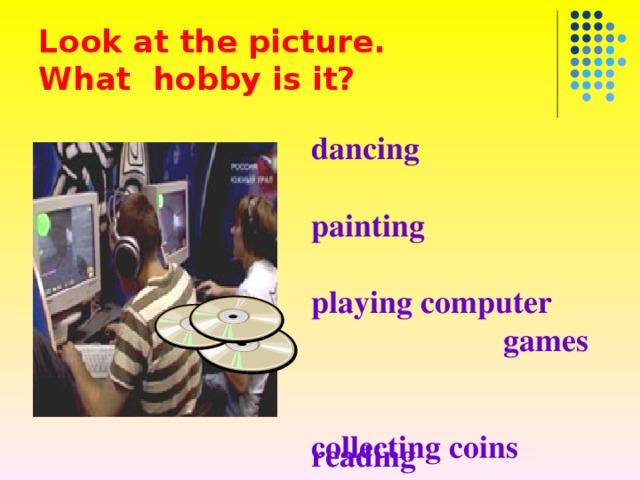 Look at the picture .  What hobby is it? dancing  painting  playing computer  games  reading  collecting stamps  photography  music collecting coins 