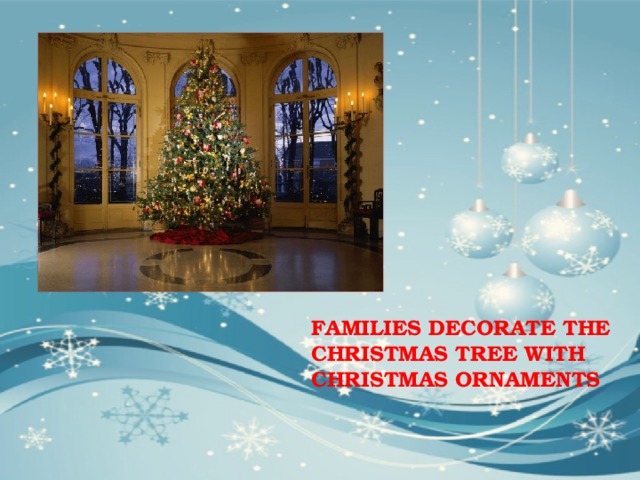 FAMILIES DECORATE THE CHRISTMAS TREE WITH CHRISTMAS ORNAMENTS 