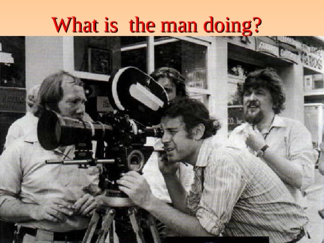 What is the man doing?   